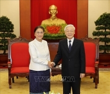 Party and State leader hosts Lao top legislator