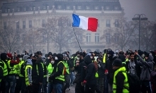 France suspends fuel tax hike for six months to quell protests