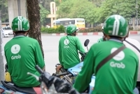 Thu hộ thuế cho đối tác tài xế, Grab chịu áp lực “trên đe, dưới búa” (!)