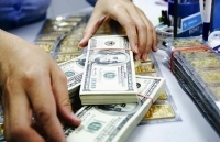 Giá vàng và USD giảm phiên thứ 4 liên tiếp