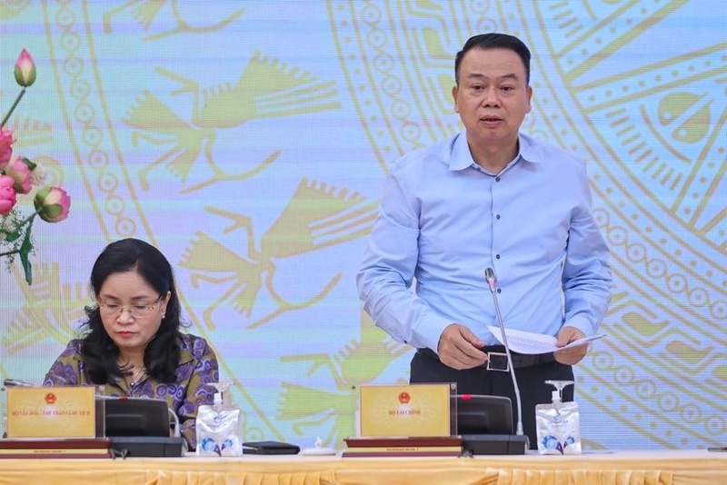 Thứ trưởng Bộ Tài chính Nguyễn Đức Chi trả lời câu hỏi của phóng viên về thí điểm giao dịch tài sản mã hóa. Ảnh: VGP/Nhật Bắc