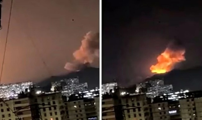 Khói lửa bốc lên sau nhiều vụ nổ lớn tại thủ đô Caracas của Venezuela ngày 3/1. Nguồn: NDTV World