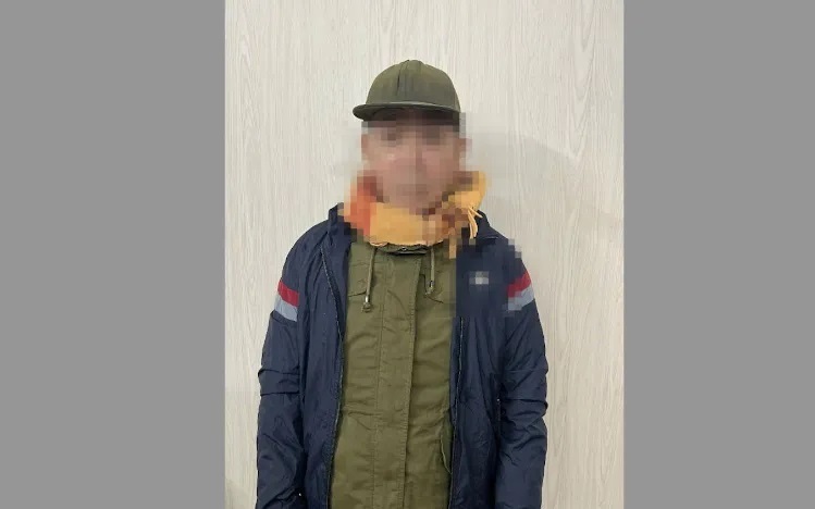 Tài xế xe ôm Phạm Văn Lịch tại cơ quan công an. Ảnh: HK