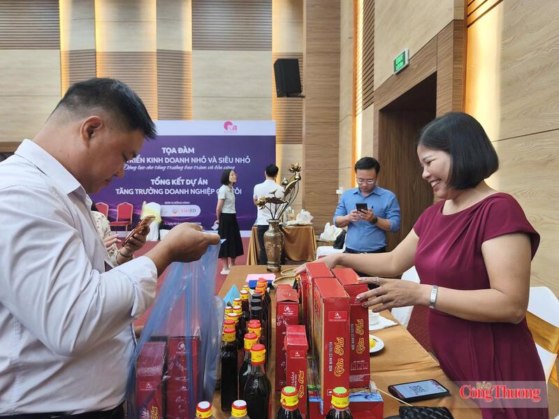 Hỗ trợ doanh nghiệp tiếp cận thị trường. Ảnh: Nguyễn Hoà