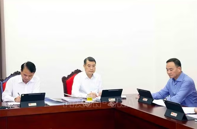 Thủ tướng Lê Minh Hưng và các đại biểu thảo luận tại tổ. Ảnh: Thống Nhất/TTXVN