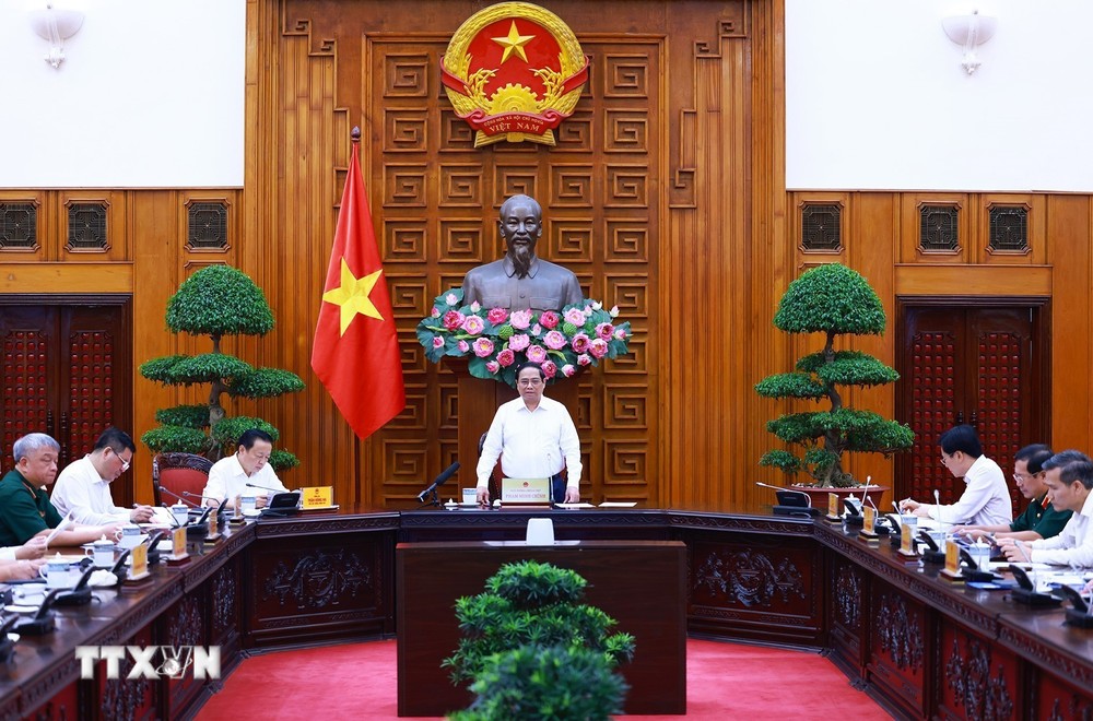 Thủ tướng Phạm Minh Chính chủ trì làm việc với các bộ, ngành, địa phương để đẩy nhanh tiến độ hoàn thành Dự án đường dây tải điện 500kV mạch 3. (Ảnh: Dương Giang/TTXVN) TTXVN_1308Thutuong1.jpg