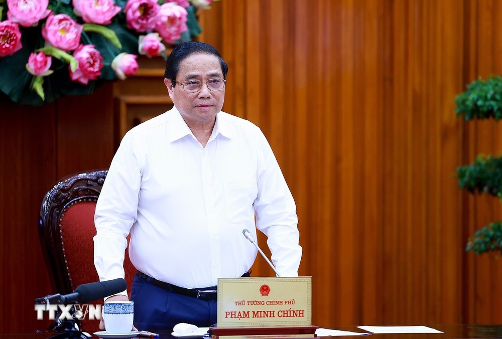 Thủ tướng Phạm Minh Chính chủ trì làm việc với các bộ, ngành, địa phương để đẩy nhanh tiến độ hoàn thành Dự án đường dây tải điện 500kV mạch 3. (Ảnh: Dương Giang/TTXVN) TTXVN_1308Thutuong2.jpg