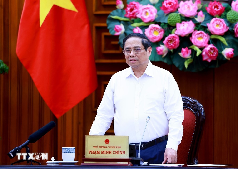 Thủ tướng Phạm Minh Chính chủ trì làm việc với các bộ, ngành, địa phương để đẩy nhanh tiến độ hoàn thành Dự án đường dây tải điện 500kV mạch 3. (Ảnh: Dương Giang/TTXVN) TTXVN_1308Thutuong3.jpg
