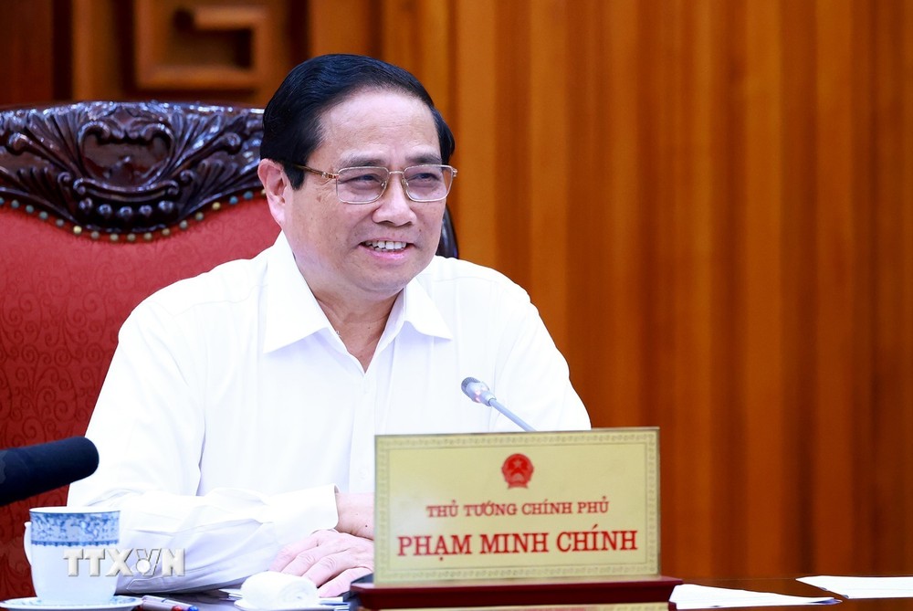 Thủ tướng Phạm Minh Chính chủ trì làm việc với các bộ, ngành, địa phương để đẩy nhanh tiến độ hoàn thành Dự án đường dây tải điện 500kV mạch 3. (Ảnh: Dương Giang/TTXVN) TTXVN_1308Thutuong4.jpg