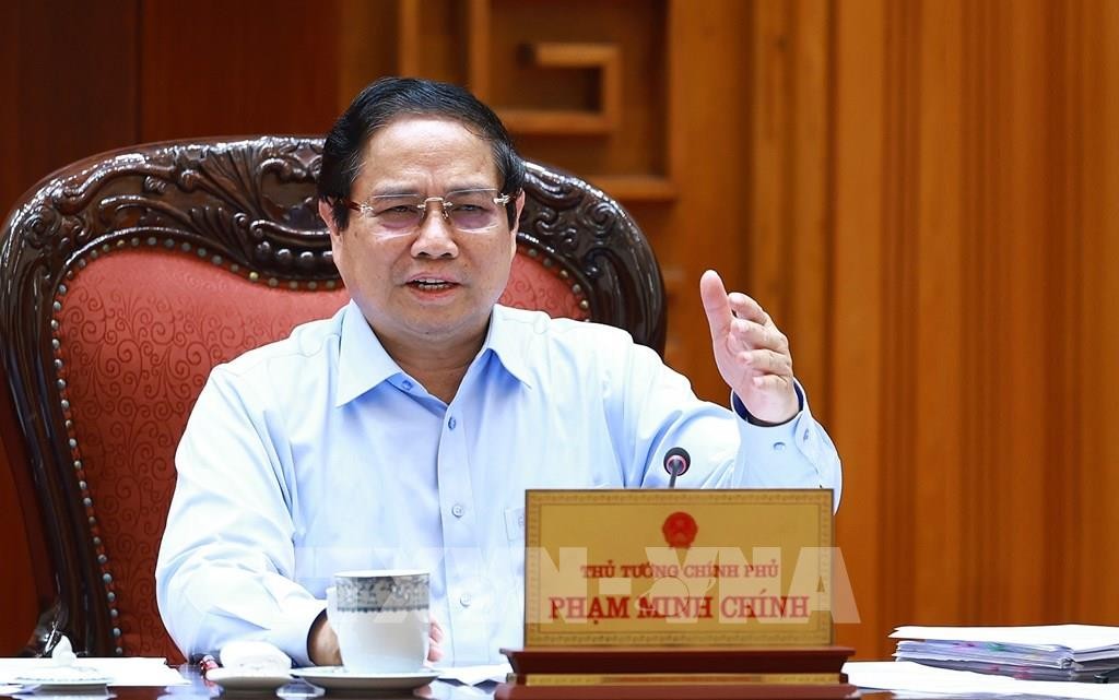 Thủ tướng Phạm Minh Chính chủ trì họp Thường trực Chính phủ với các bộ, ngành và Đoàn đàm phán Chính phủ về các vấn đề thương mại với Hoa Kỳ. Ảnh: Dương Giang-TTXVN