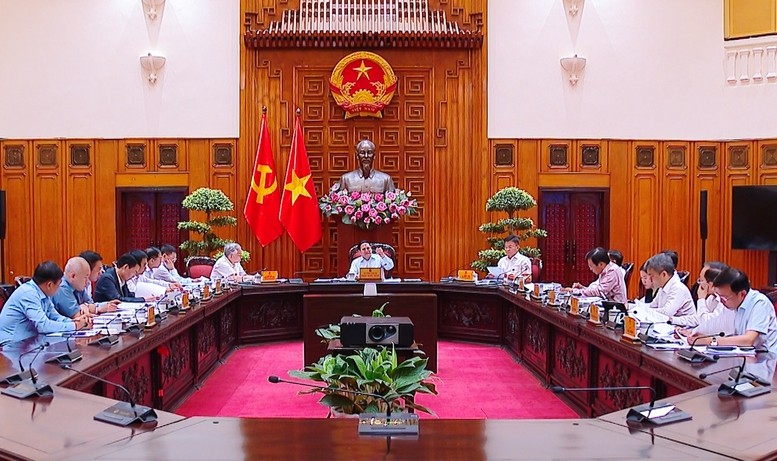 Dự án Luật sửa đổi, bổ sung một số điều của 7 luật được thảo luận tại cuộc họp - Ảnh: VGP/Nhật Bắc