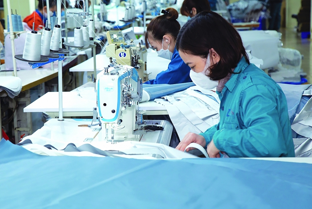 Dệt may là một trong những ngành hàng điển hình có nhiều cơ hội thúc đẩy XK vào thị trường Vương quốc Anh thời gian tới. 	Ảnh: N.Thanh